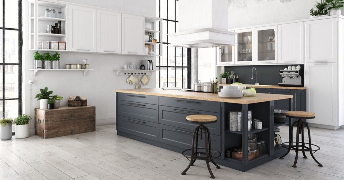 Open kitchen and kitchen island with grey wood flooring