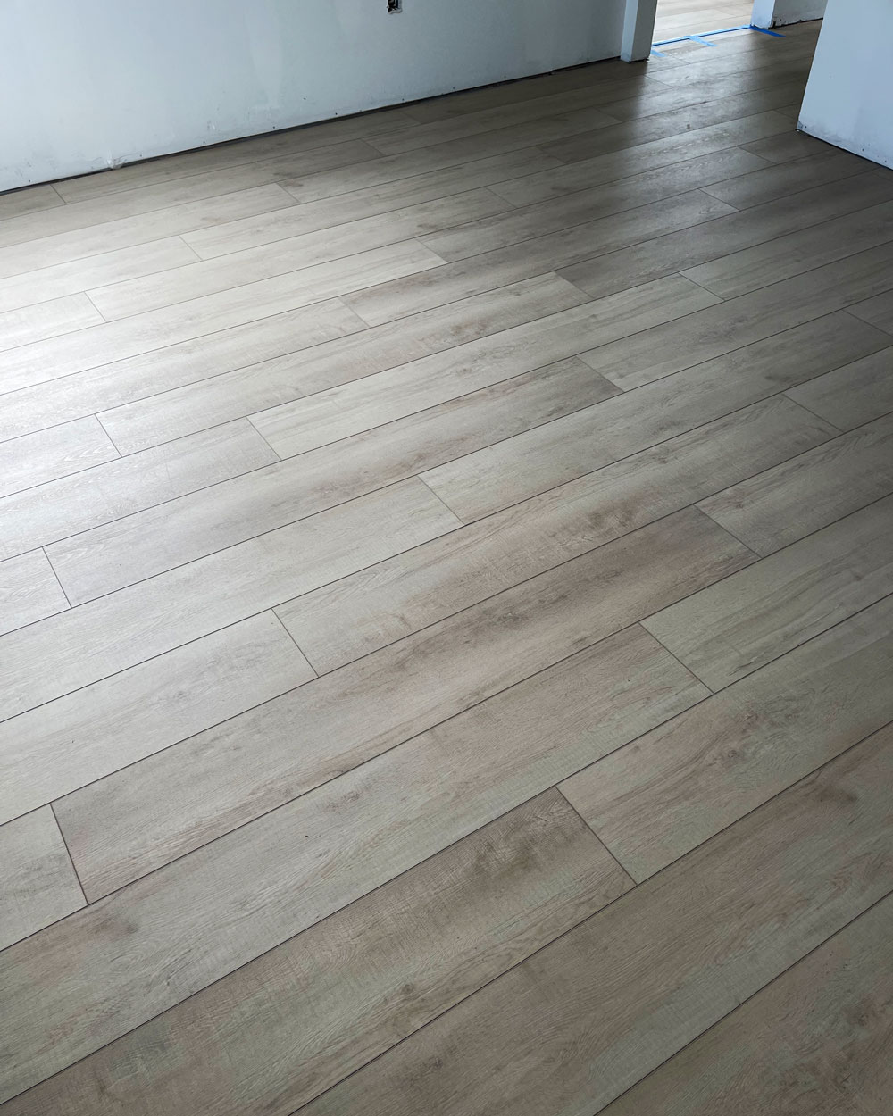 Room with grey vinyl plank flooring