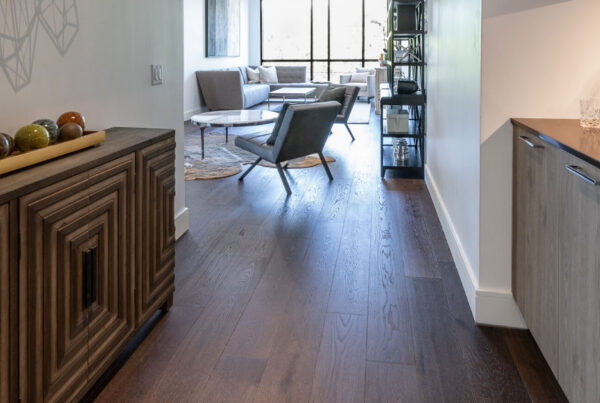 Hallway with dark brown hardwood flooring