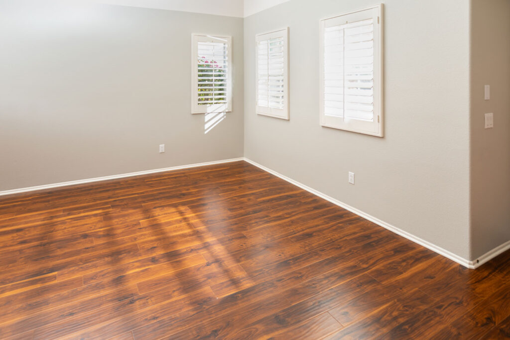 Newly installed laminate flooring and baseboards